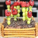 Mother's Day Dessert Idea: chocolate cake topped with strawberry roses and decorated to look like a garden.