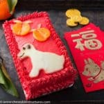 Vanilla cake decorated to look like a red envelope to celebrate Chinese New Year.