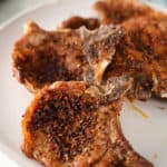 4 air fryer pork chops on a plate